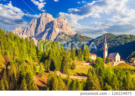 Dolomites - South Tyrol, Italy. Beautiful famous landscape with Chiesa di Colle Santa Lucia and Mount Pelmo. Dolomites - South Tyrol, Italy. Beautiful famous landscape with Chiesa di Colle Santa Lucia and Mount Pelmo. 126224973