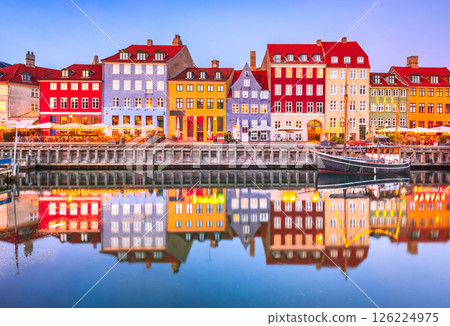 Copenhagen, Denmark. Nyhavn, Kobenhavn's iconic canal, colorful night water reflection. Copenhagen, Denmark. Nyhavn, Kobenhavn's iconic canal, colorful night water reflection. 126224975