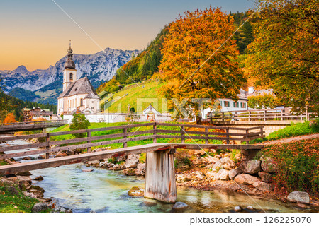 Ramsau am Berchtesgaden, Germany. Autum colored landscape of Saint Sebastian Church and River Ramsauer Ache, Bayern. Ramsau am Berchtesgaden, Germany. Autum colored landscape of Saint Sebastian Church and River Ramsauer Ache, Bayern. 126225070