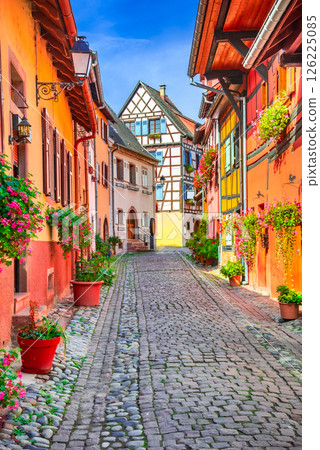 Eguisheim, France. French beautiful village, colorful half-timbered houses, cobblestone streets, medieval Alsace charm. 126225085