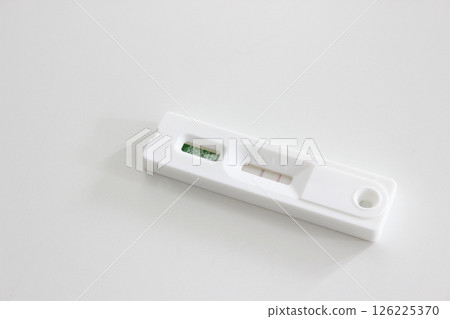 Positive test result of Covid-19 antigen test kit on the white background Positive test result of Covid-19 antigen test kit on the white background 126225370