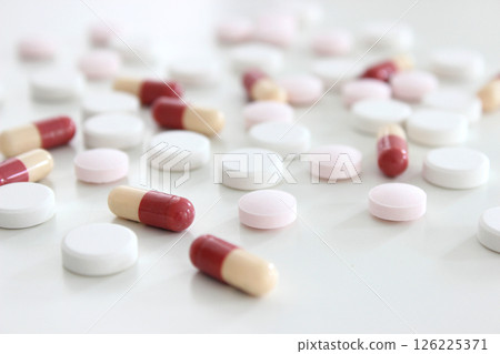 Drug tablet and capsule isolated on the white background Drug tablet and capsule isolated on the white background 126225371