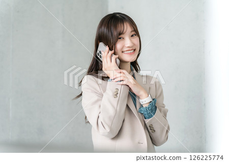 Stylish woman, designer, businesswoman making a phone call on a smartphone 126225774