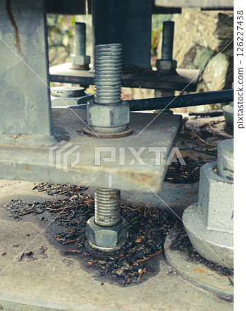 Reinforced concrete foundation with metal anchor bolts Reinforced concrete foundation with metal anchor bolts 126227438