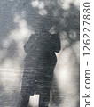A shadow of woman on the concrete background 126227880