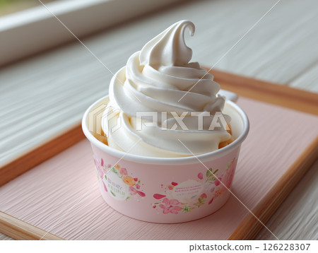 A snapshot of soft serve ice cream and natural light streaming in 126228307