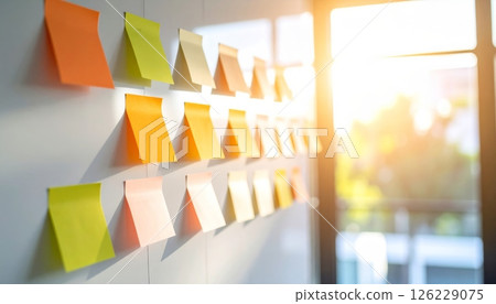 Colorful sticky notes on whiteboard in office under sunlight Colorful sticky notes on whiteboard in office under sunlight 126229075