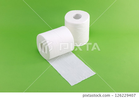 White toilet paper on a green background White toilet paper on a green background 126229407