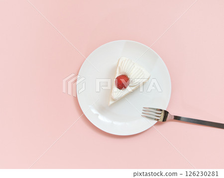 Strawberry shortcake on a white plate (top view) 126230281