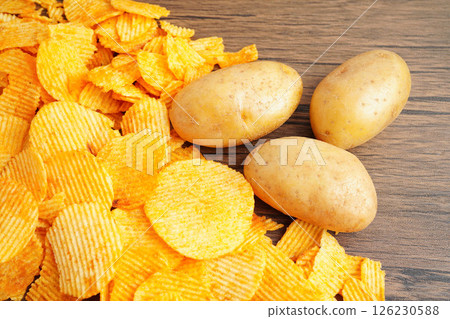 Potato chips , delicious BBQ seasoning spicy for crips, thin slice deep fried snack fast food. 126230588