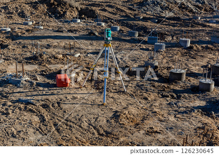 Geodetic instrument at construction site foundation Geodetic instrument at construction site foundation 126230645