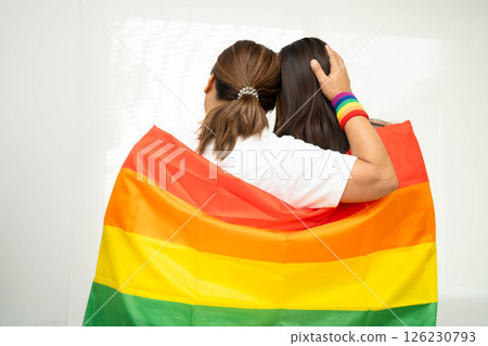Asian couple woman with LGBT rainbow flag. Asian couple woman with LGBT rainbow flag. 126230793