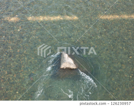 Rocks in the crystal clear Niyodo River 126230957