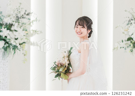 Bride / bride woman with a bouquet at the wedding hall 126231242