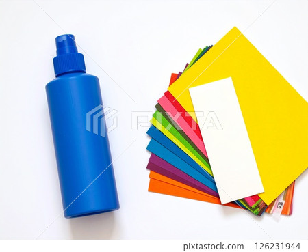 Colored paper and glue on the table 126231944