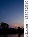 Evening landscape with contrails 126232519