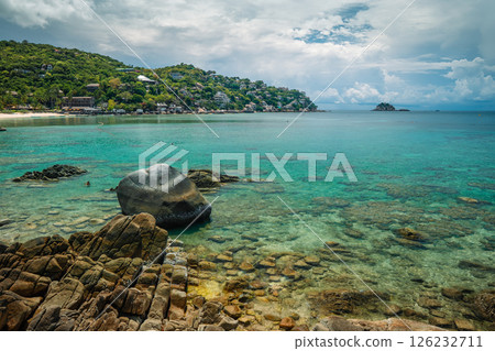 Summer vacation landscape of a bay and clear blue beach with rocks and corals on Koh Tao. Summer vacation landscape of a bay and clear blue beach with rocks and corals on Koh Tao. 126232711
