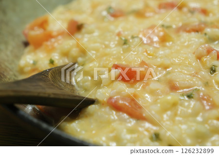 Tomato risotto with lots of cheese Tomato risotto with lots of cheese 126232899