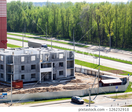 Construction of an apartment building against the backdrop of a forest in the city in summer, industry 126232918