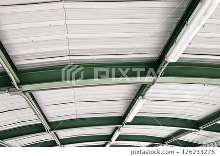 Fluorescent Tube Lights on Corrugated Metal Roof. 126233278