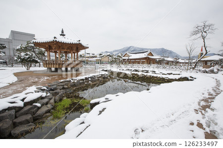 Observatory above a small snowy lake 126233497
