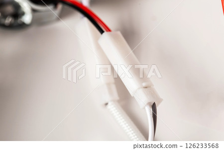Electrical wires and fastening in a ceiling chandelier, close-up Electrical wires and fastening in a ceiling chandelier, close-up 126233568