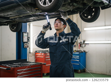 A young mechanic's daily routine 126233579
