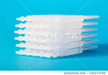 Tubes with a new generation probiotic on a blue background for the treatment of intestinal diseases. Restoration of intestinal microflora during dysbacteriosis. Tubes with a new generation probiotic on a blue background for the treatment of intestinal diseases. Restoration of intestinal microflora during dysbacteriosis. 126233598