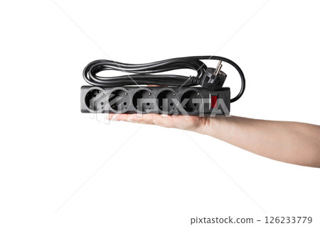 Modern black electrical filter with socket connectors on white background, on hand, insulator, isolate Modern black electrical filter with socket connectors on white background, on hand, insulator, isolate 126233779