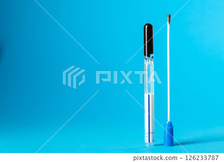 Smear for flora and bacterial culture in men and women on a blue background in urology and gynecology. Sexually transmitted infections. Copy space for text 126233787