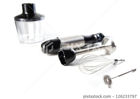 Modern set for immersion blender with whisk, milk frother and bowl on white background. Modern household appliances, close-up. Copy space for text 126233797