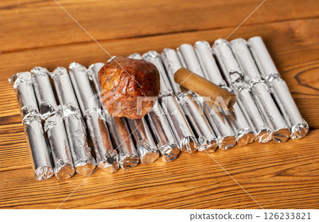 Rectal propolis suppository for eliminating edema and microbes in urology during the treatment of prostatitis, close-up Rectal propolis suppository for eliminating edema and microbes in urology during the treatment of prostatitis, close-up 126233821