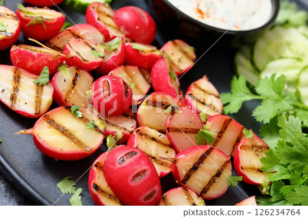 grilled radishes with cucumber slices and sauce grilled radishes with cucumber slices and sauce 126234764