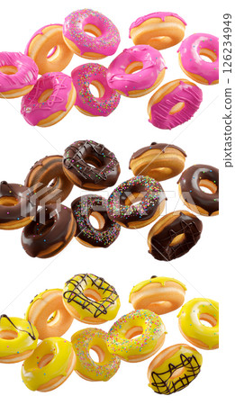 Assorted donuts with colorful icing, sprinkles, and chocolate isolated on white transparent background 126234949