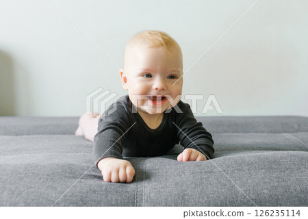 Happy Toddler Playing On Sofa 126235114