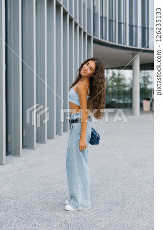 Stylish Girl Smiling Outdoors In Summer 126235133