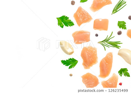 Raw chicken fillet chunks with spices, garlic and herbs isolated on white background. copy space, top view 126235499