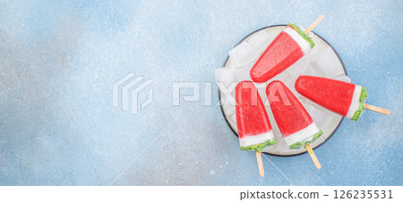 Homemade strawberry ice cream popsicles on white plate, Summer food concept. Top view Homemade strawberry ice cream popsicles on white plate, Summer food concept. Top view 126235531