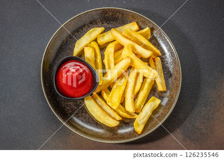 Homemade French fries with ketchup roasted in the air fryer, top view. copy space for text Homemade French fries with ketchup roasted in the air fryer, top view. copy space for text 126235546