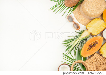 Summer background. Traveler accessories, tropical palm leaf branches on white background. Travel vacation concept, top view, space for text 126235553