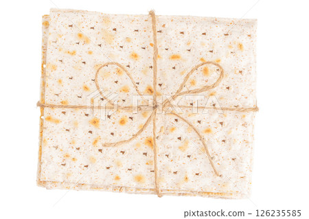 Traditional Jewish bread matzo for passover isolated on white background. top view. Pesah celebration concept 126235585