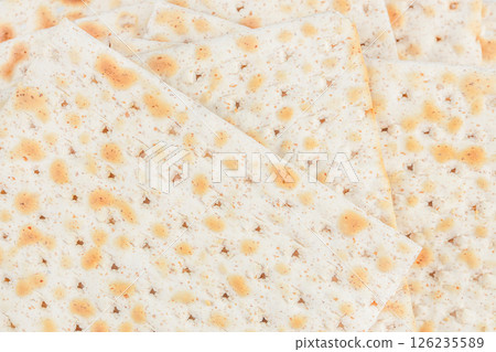 Matzah for passover Jewish pesach background. top view Matzah for passover Jewish pesach background. top view 126235589
