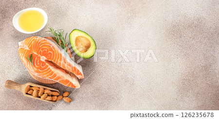 Set of healthy products with high omega 3 salmon, avocado, oil, nuts, keto diet, copy space, top view 126235678
