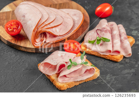 tasty sandwiches with boiled sausage and tomato tasty sandwiches with boiled sausage and tomato 126235693
