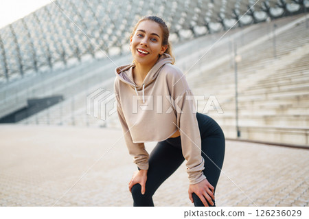 Beautiful woman outdoors and sportswear doing fitness. Concept of sport, recreation. Beautiful woman outdoors and sportswear doing fitness. Concept of sport, recreation. 126236029