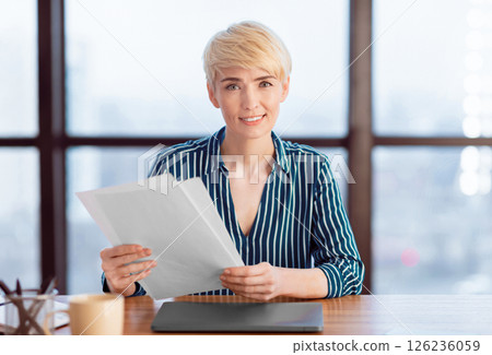 Business Career And Employment. Businesswoman Employer Holding Papers And Documents Smiling To Camera Sitting In Modern Office. Selective Focus 126236059