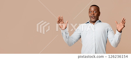 No way. Amazed african american middle aged man raising hands in fully disbelief, orange background No way. Amazed african american middle aged man raising hands in fully disbelief, orange background 126236154