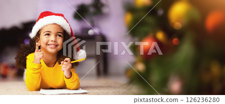 Got it. Excited black little girl got idea about Christmas gift, writing letter to Santa Got it. Excited black little girl got idea about Christmas gift, writing letter to Santa 126236280