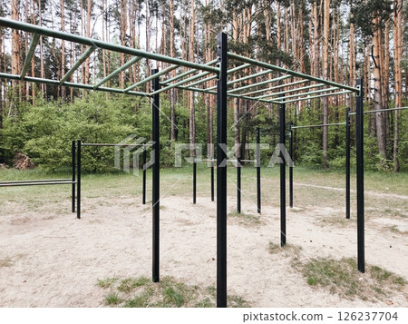 horizontal bars, outdoor sports ground for workout in the park. sports ground for workout in the park. workout area without people. horizontal bars, outdoor sports ground for workout in the park. sports ground for workout in the park. workout area without people. 126237704