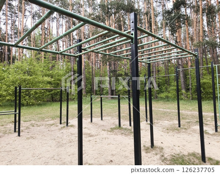 horizontal bars, sports ground for workout in the park. workout area without people. horizontal bars, sports ground for workout in the park. workout area without people. 126237705